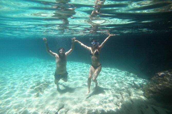3 Hour Group Tour by Boat to the Caves of Santa Maria di Leuca - Stop 1 at Grotte Marine di Leuca: snorkel gear and the first cave swims