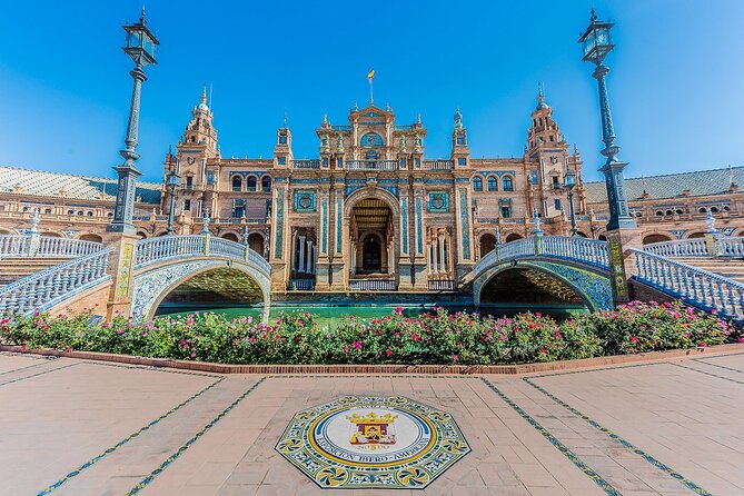 Alcazar, Cathedral, Santa Cruz Quarter, Bullring and River Cruise Tour in Seville - Triana panoramic views and the Isabel II Bridge photo run