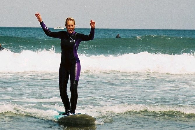 Beginner Surf Lesson in Santa Cruz - Getting on the board: paddling out, then learning to catch whitewater