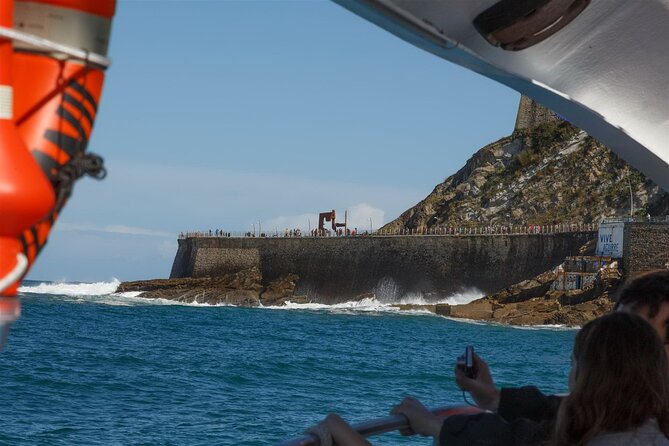 Boat by the Bay and Santa Clara Island in Donostia San Sebastian - What you see passing key landmarks from town hall to Wind Comb