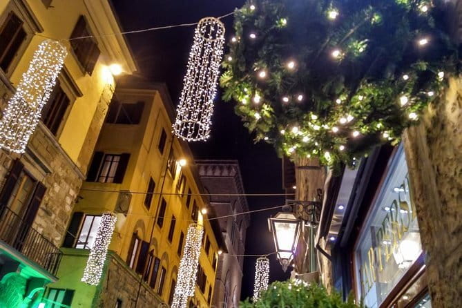 Christmas Lights Private Photo Tour in Florence - Stop 2: Ponte Vecchio for reflections and layered nighttime depth