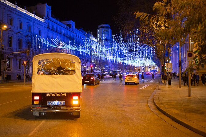 Christmas Lights Tour of Madrid in Eco Tuk Tuk Private - Cibeles Square: architecture, lions, and Real Madrid energy